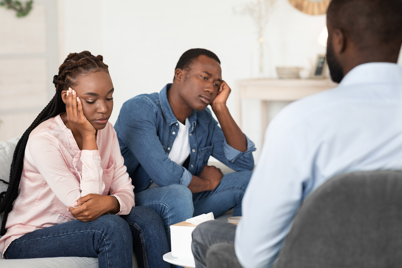 Marital Psychotherapy. Sad Black Couple Sitting At  Session With Psychologist