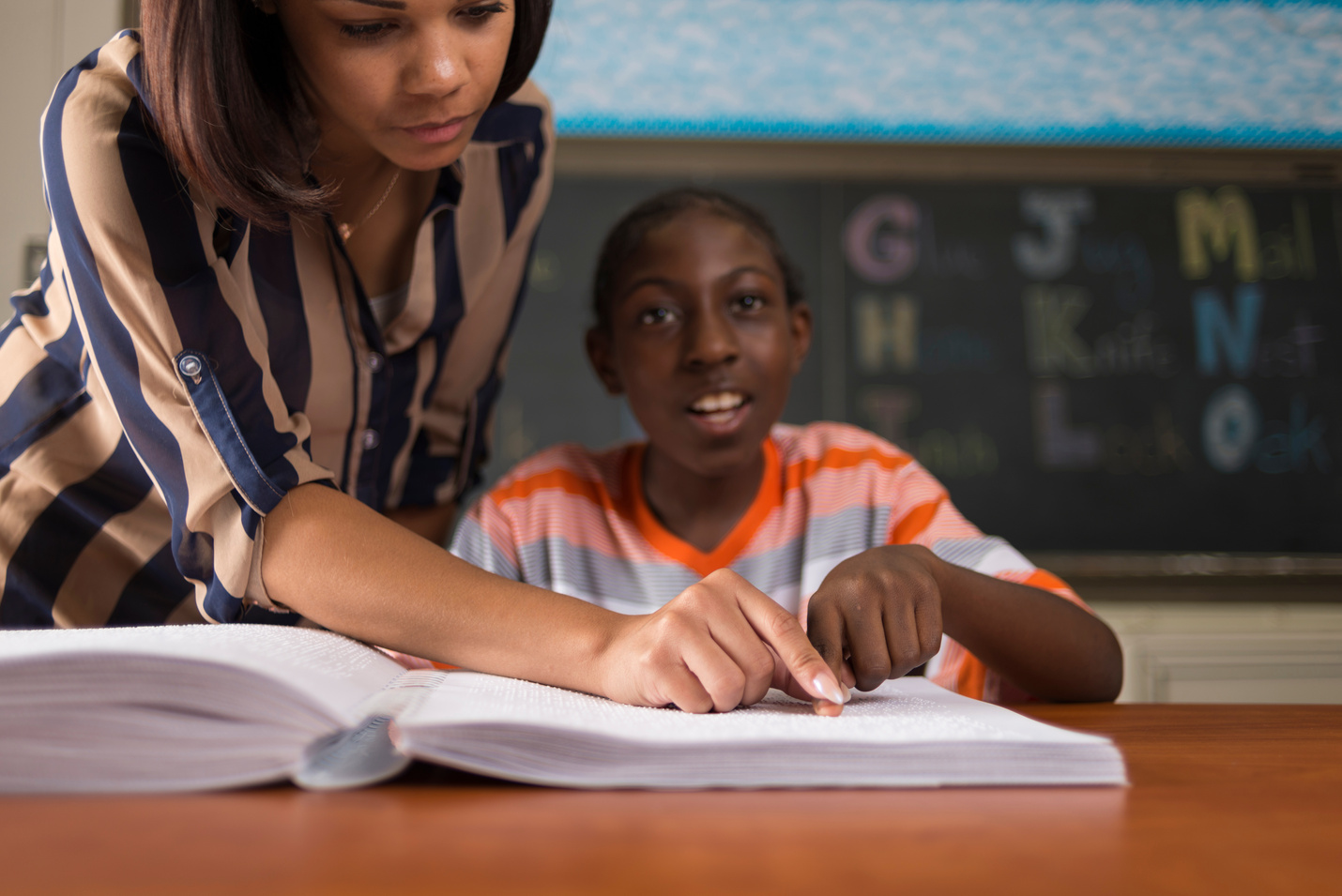 Student Learning Braille