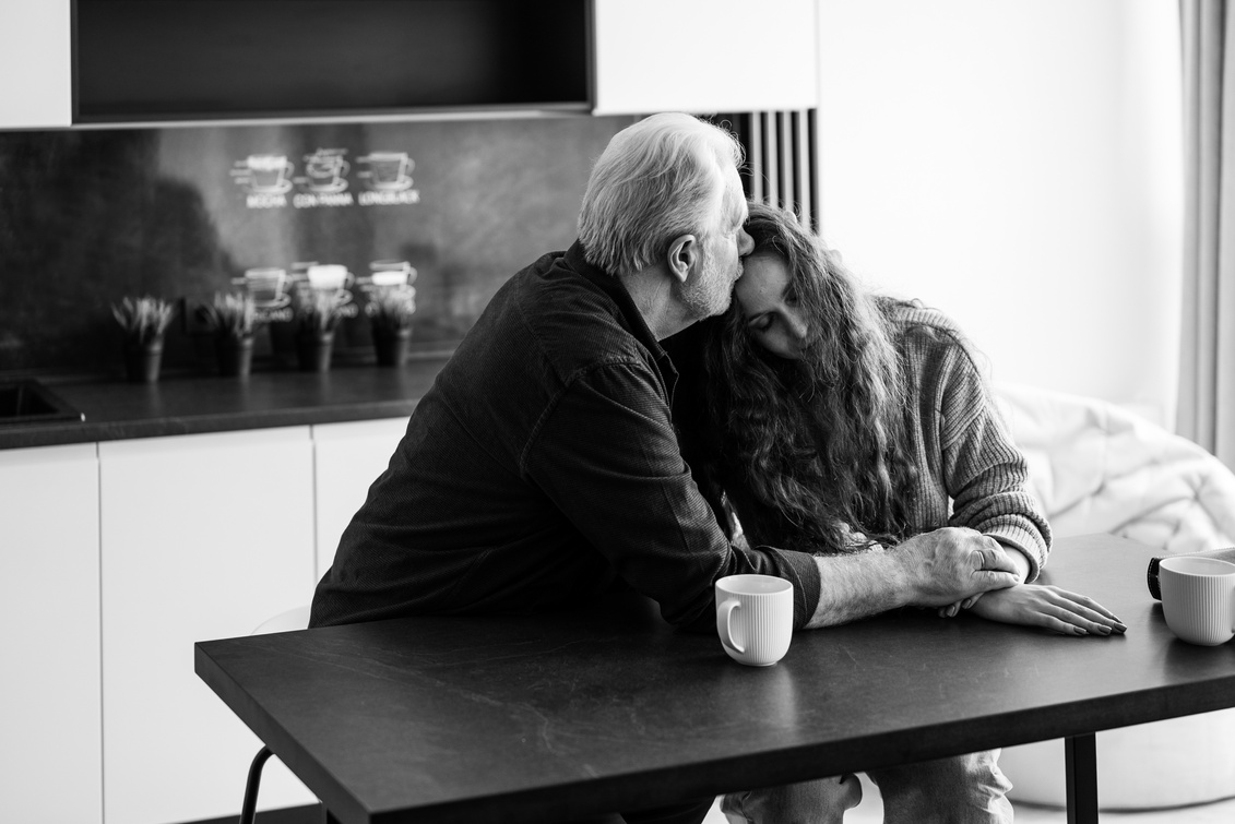 An Elderly Man and a Woman Expressing Grief and Sorrow