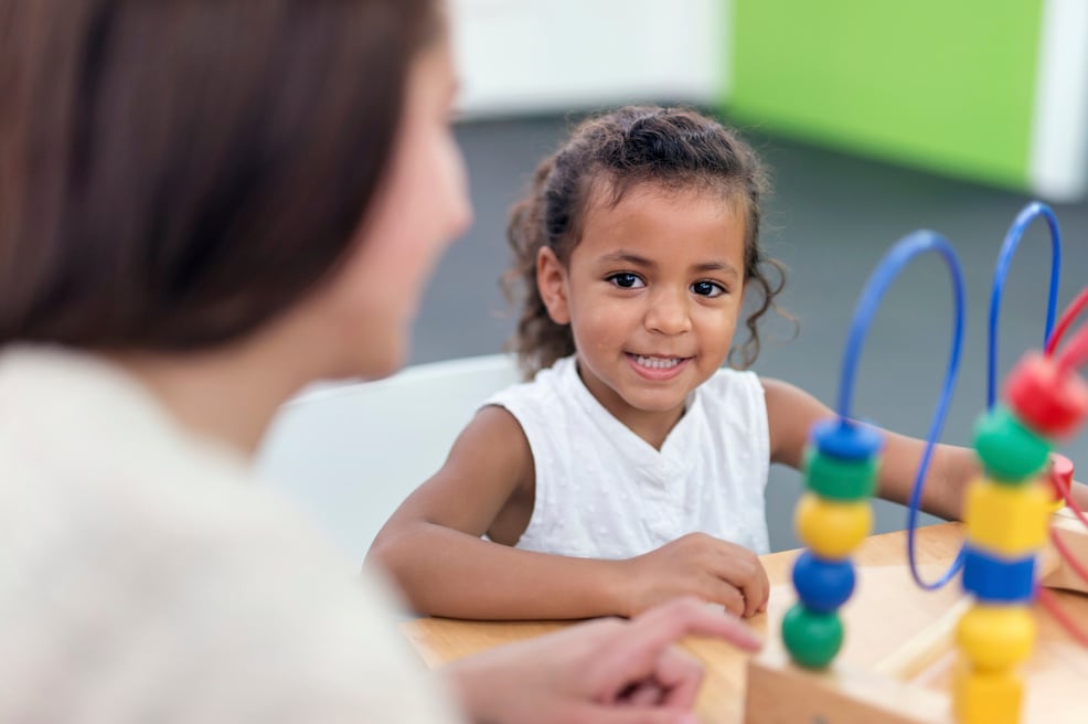 Young female child smiling during her therapy session